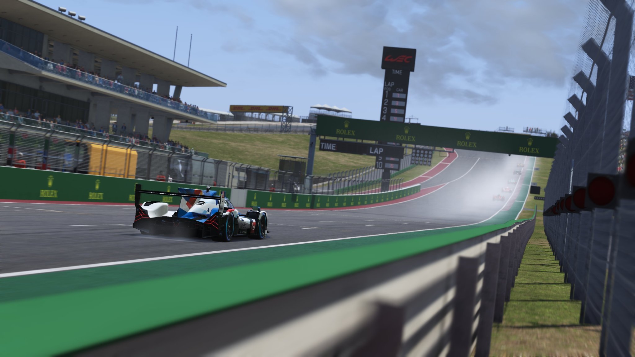 Le Mans Ultimate racing GT3 cars driving in wet and rainy conditions