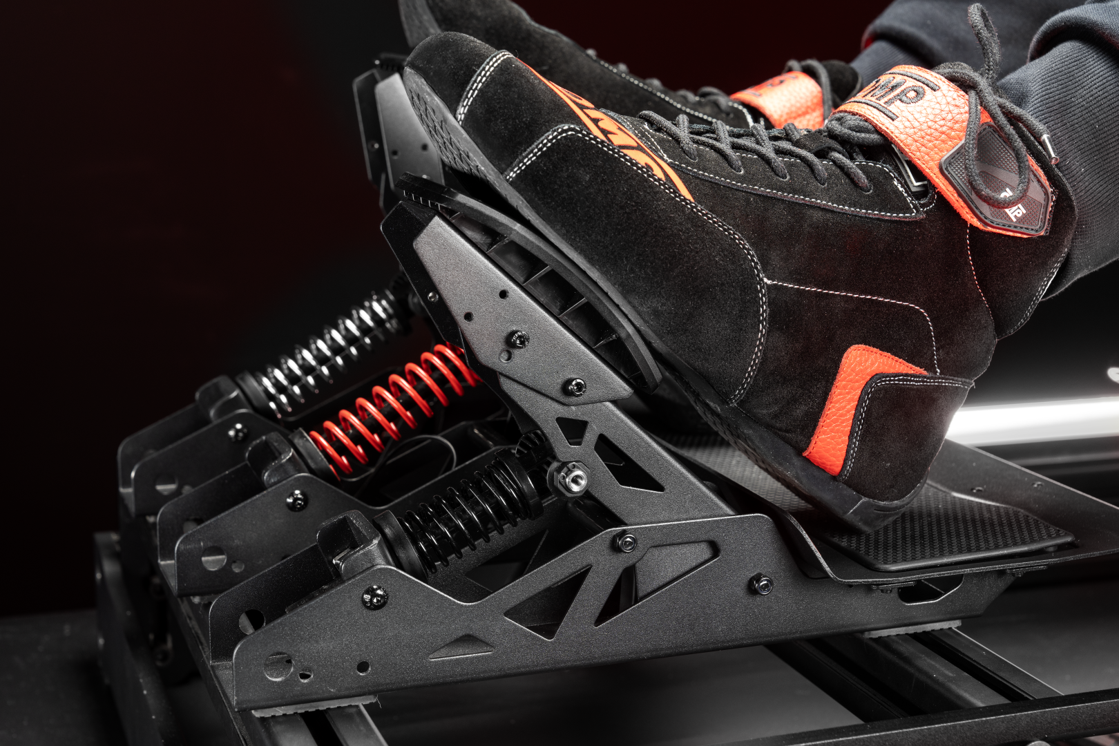 Simagic P700 pedals brake being pressed with racing shoe showing load cell resistance
