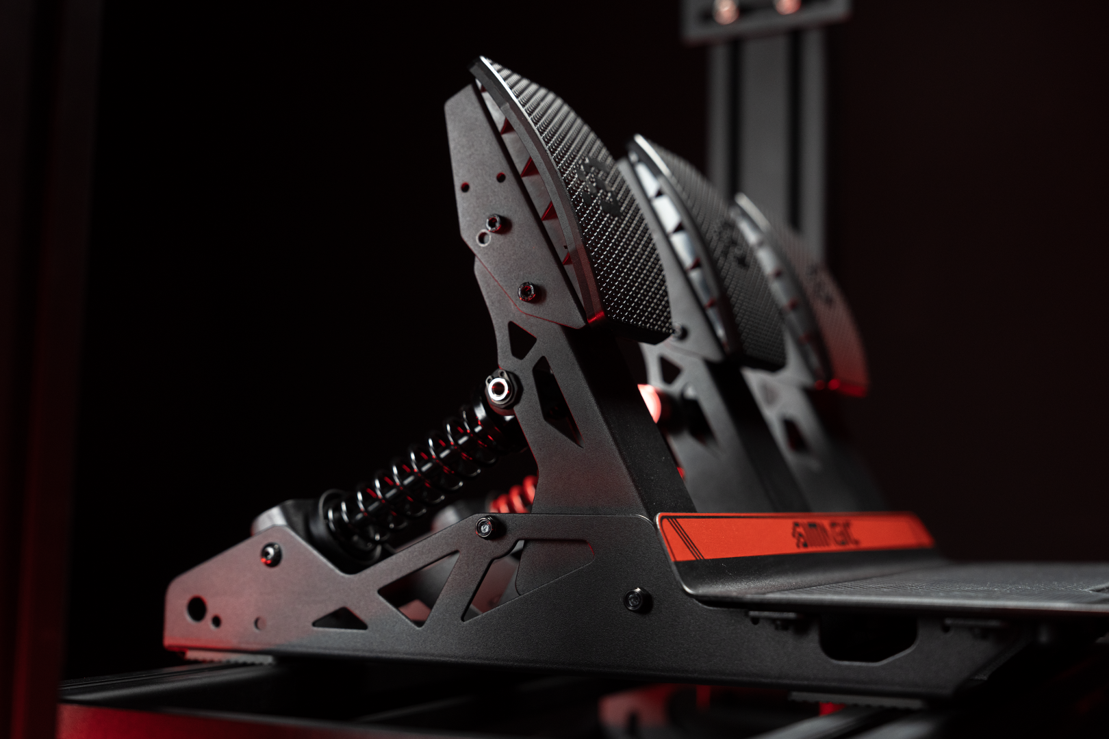 Side view of Simagic P700 pedals showing adjustable angle and metal construction