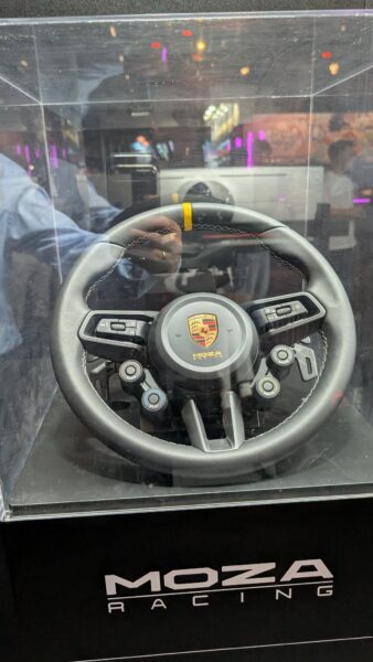 MOZA x Porsche 911 GT3 RS steering wheel with detachable display and Porsche crest, shown at Gamescom 2026