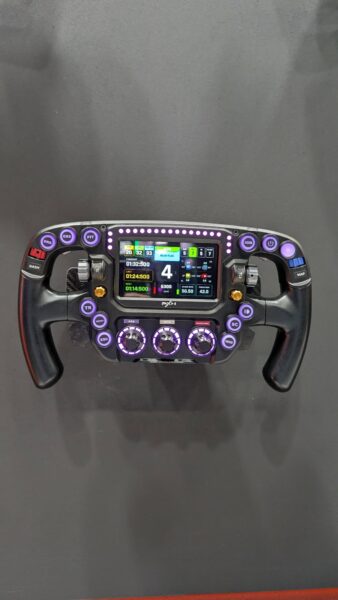 PXN W FS Formula wheel with purple-lit buttons and telemetry display