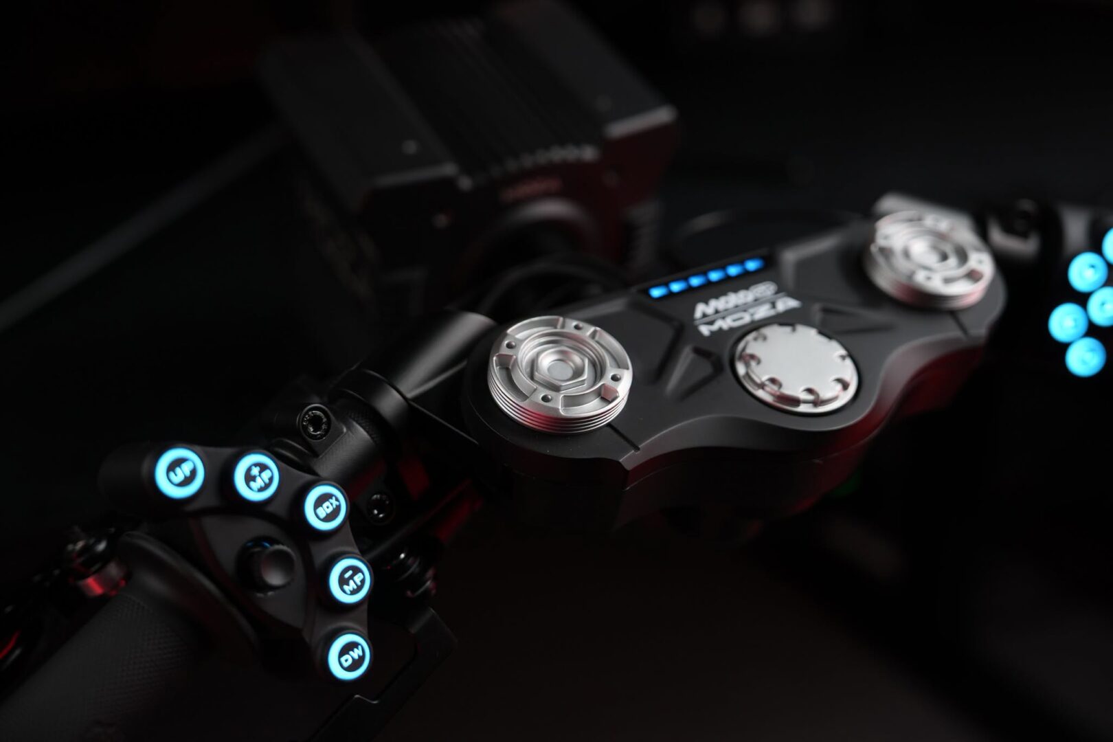Close-up of MOZA MotoGP handlebar button cluster and shift lights