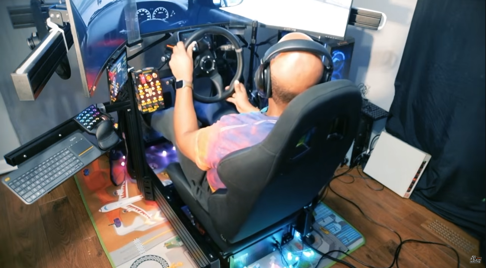Sim racer driving Richard Burns Rally on a rig with the DX2 Ultra seat mover