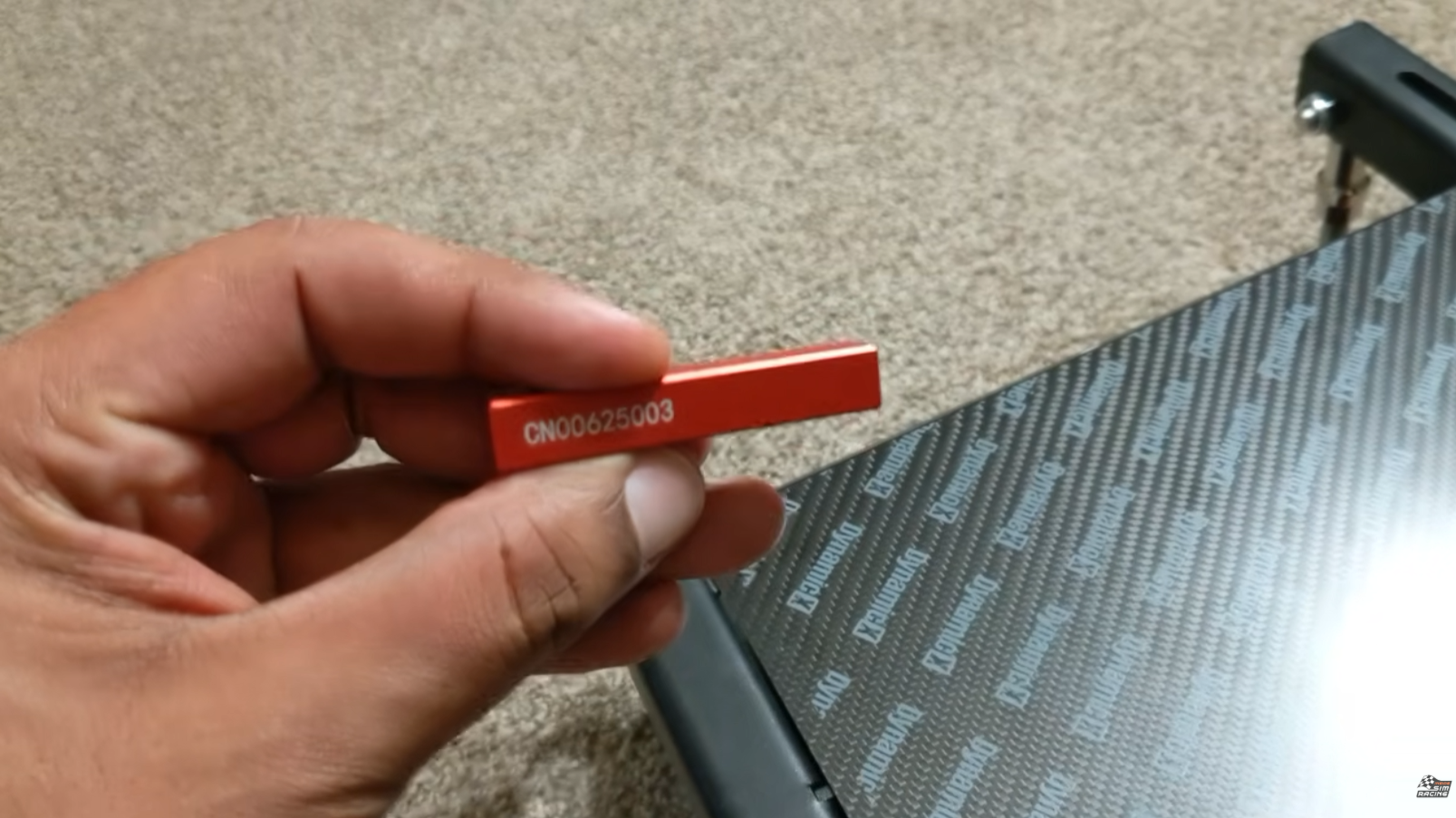 Aluminum ingot included with the DX2 Ultra, laser engraved with the unit's serial number
