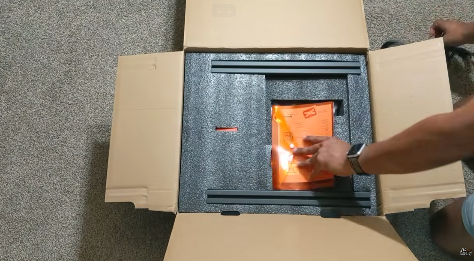 Dynamic X DX2 Ultra seat mover unboxed with power and USB cables, seat adapters, and accessories