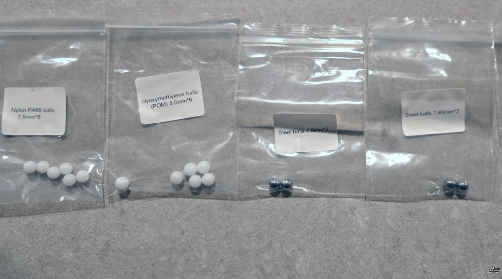 Five interchangeable detent ball types included with the SimNet SSQ-1: nylon, POM, ceramic, and two steel sizes