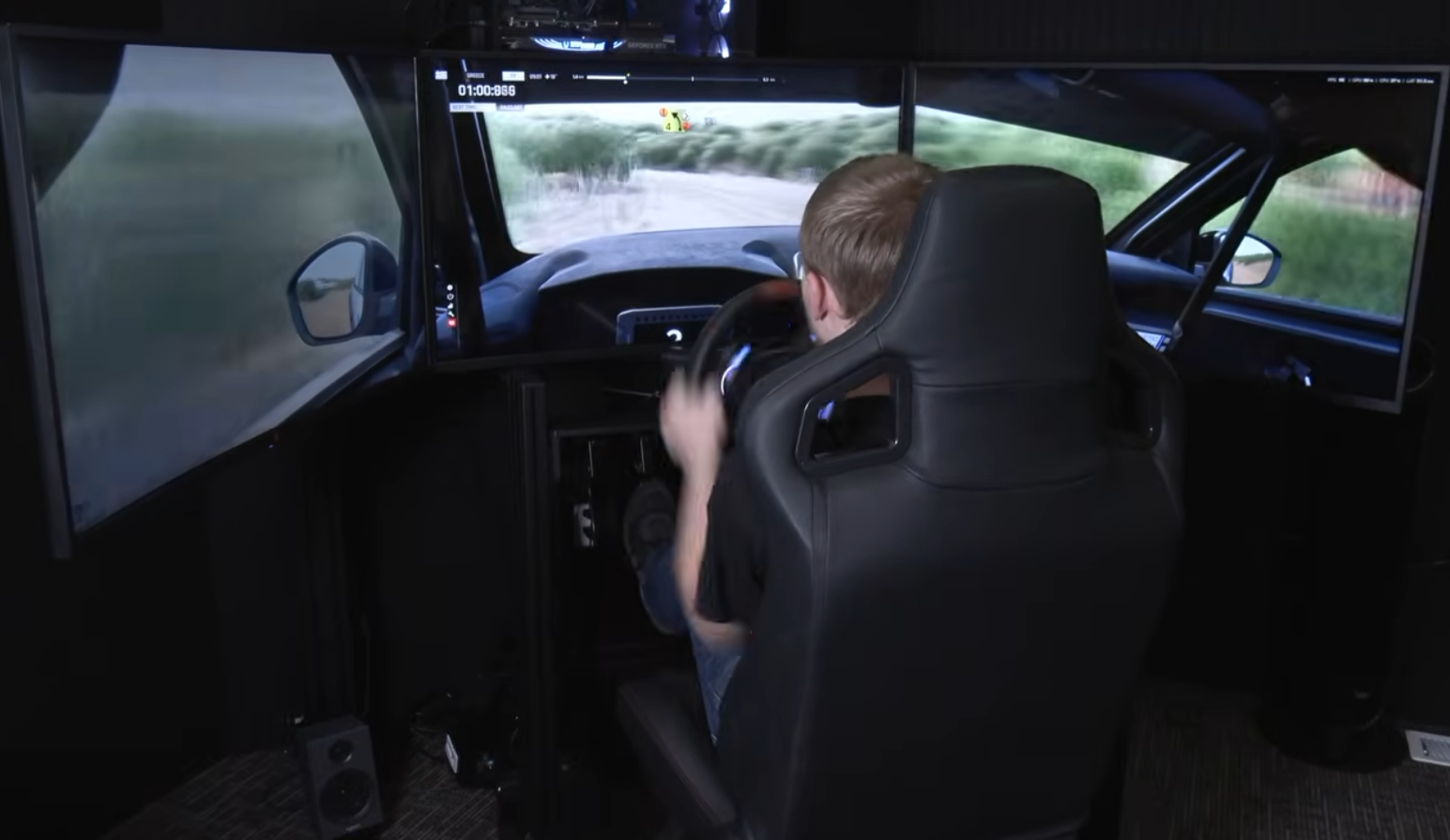 SimRig SR3 3DOF motion rig in front of freestanding triple 39-inch Deco Gear monitors